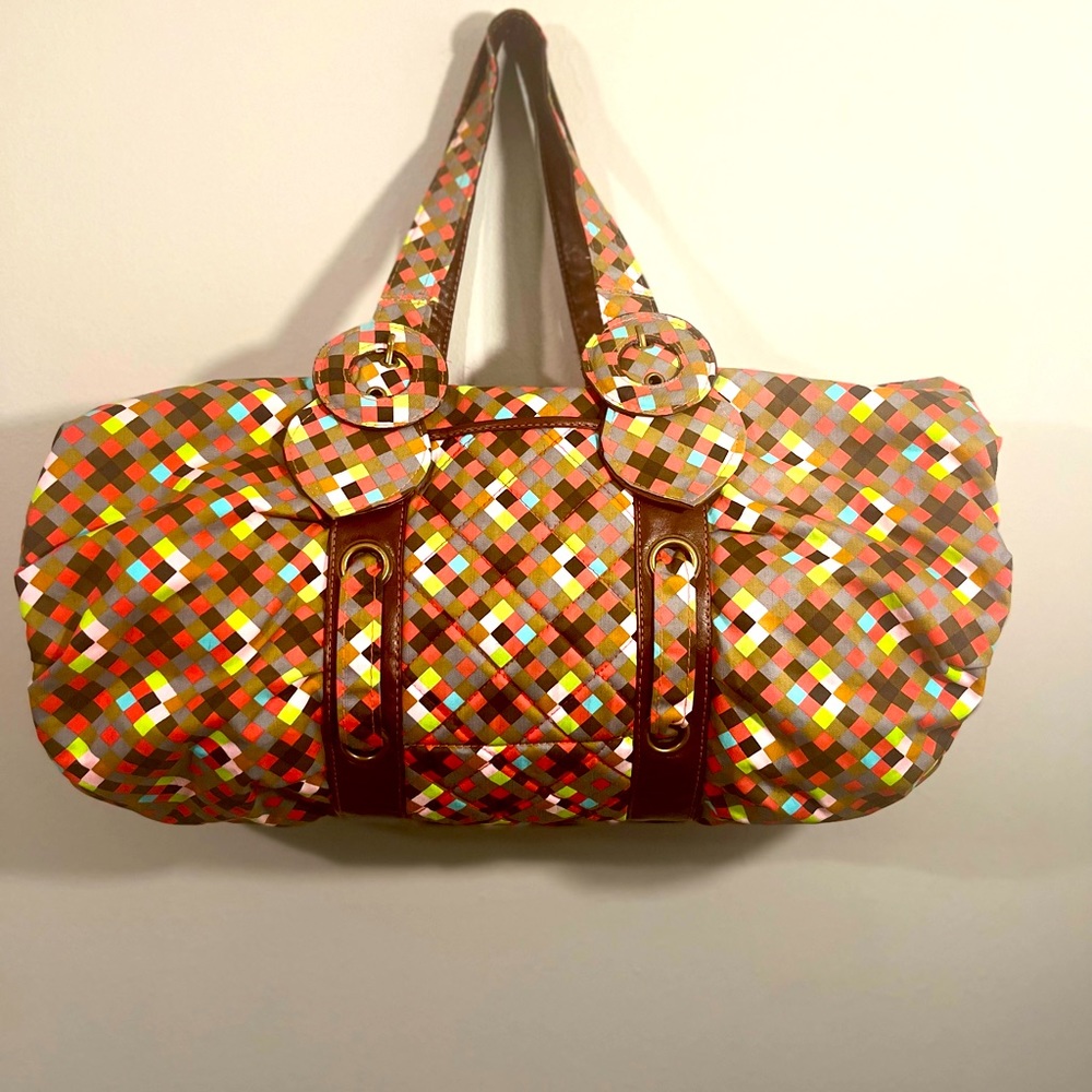 Super cute multi color bag! So fun and spacious.